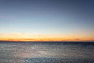 Sunrise on sea golden blue colors