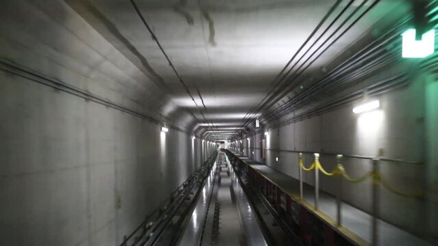 Movement on train in tunnel with illumination on railway