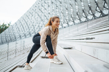 Young woman with smart watch goes in for sports, performs sport exercises. Sport, Active life,...