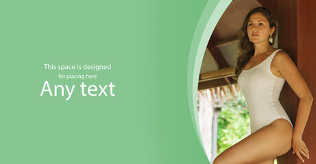 Young and beautiful woman in white swimsuit. Woman posing in exotic Thai bungalow. Resting and traveling concept.