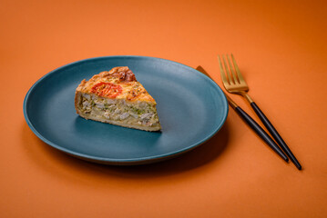 Delicious quiche with tomato, cheese, chicken, spices and herbs