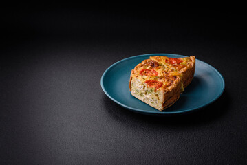 Delicious quiche with tomato, cheese, chicken, spices and herbs