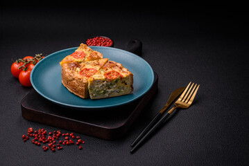 Delicious quiche with tomato, cheese, chicken, spices and herbs