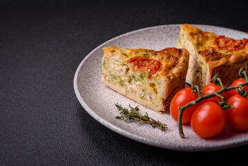 Delicious quiche with tomato, cheese, chicken, spices and herbs