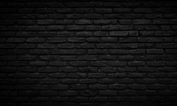 Elegante Dunkelheit: Schwarze Backsteinwand als stilvoller Hintergrund