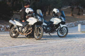 Hellenic Police, Greek police squad on duty riding bike and motorcycle, maintain public order in the streets of Athens, Attica, Greece, group of policemen with "Greek Police" logo emblem on uniform