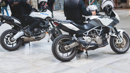 Fototapeta na wymiar Hellenic Police, Greek police squad on duty riding bike and motorcycle, maintain public order in the streets of Athens, Attica, Greece, group of policemen with 