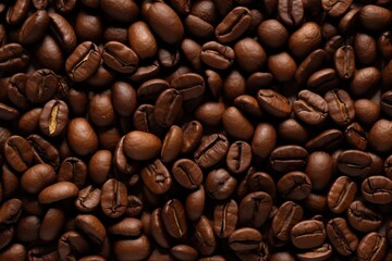 Obraz premium Coffee beans background. Close up of roasted coffee beans.