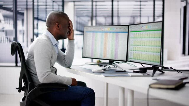 Data Analyst African Man Using Spreadsheet