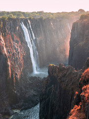 Victoria Falls on the Zambezi River on the border of Zambia and Zimbabwe in South Africa - obrazy, fototapety, plakaty