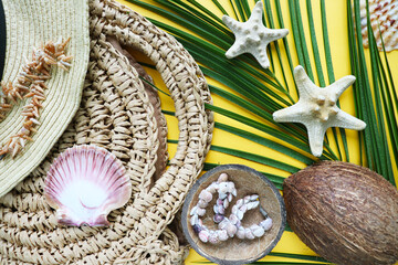 ummer holiday concept. straw hat, palm branch and seashells. white blank