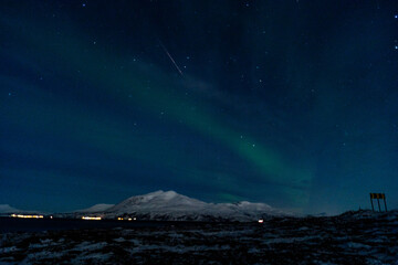 Northern lights night in Tromso in Norway ona cold night in winter  - obrazy, fototapety, plakaty