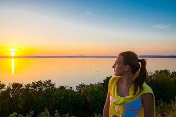 Young woman at sunset at Balatonvilagos near the Lake Balaton