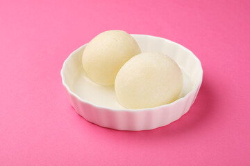Rasgulla or rosogulla - an Indian sweet made from khoya, soft and spongy, in earthen bowl 