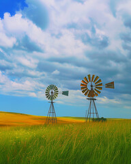 Windmills turning in a field, harnessing the power of the spring breeze
