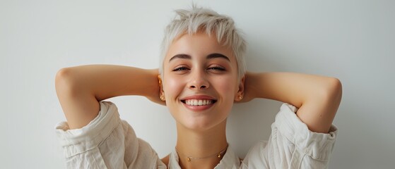 Joyful woman with short bleached hair in light clothes on a white background color photo