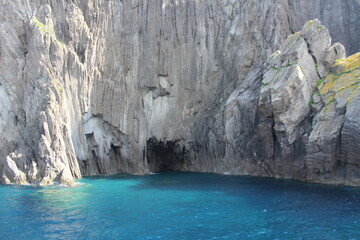 turquoise lagoon close to sicily and stone cliff