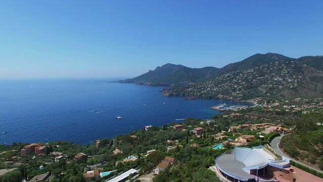 Seascape with port of Figueirette and Bubbles Palace villa on slope