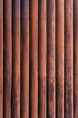 Warm-toned rusty corrugated iron sheet, perfect for creating grunge backgrounds and textured overlays in designs