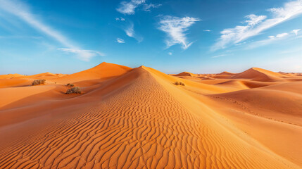Fototapeta na wymiar Wispy clouds above a sand dune formation, beautiful majestic desert landscape sand dunes in the Sahara Saharan Desert