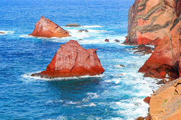 Red rock protruding out of the Atlantic Ocean at the Ponta de São Lourenço (tip of St Lawrence)...