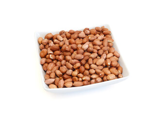 Dried peanuts in closeup on white