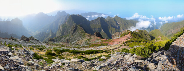 Panoramic view of the mountains visible from the summit of the Pico Ruivo, the highest mountain peak on Madeira island, Portugal - Heathland on dry slopes in the Atlantic Ocean - obrazy, fototapety, plakaty