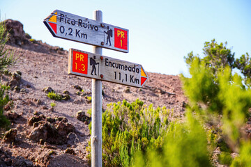 Wooden orientation signs indicating the many trails surrounding the Pico Ruivo, the highest...