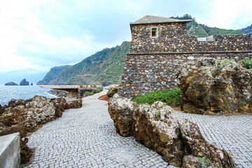 Fototapeta na wymiar Stone fortress housing the aquarium of Porto Moniz on the north coast of Madeira island (Portugal) in the Atlantic Ocean