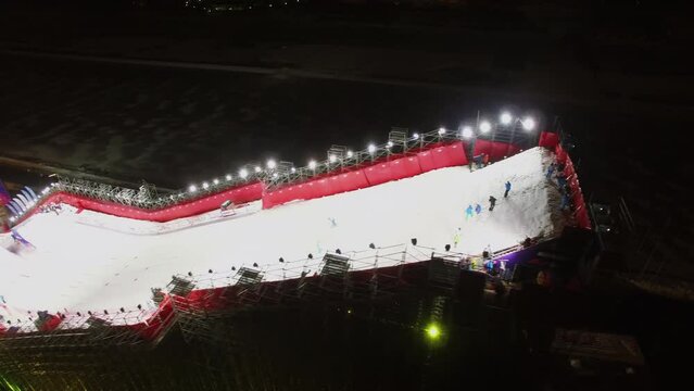 Sportsman makes attempt on snow slope with ski jump 