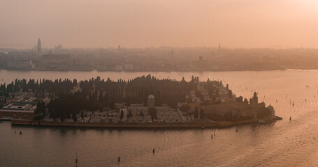Fototapeta premium Aerial view of Murano island in Venetian lagoon sea from above, Italy at sunset
