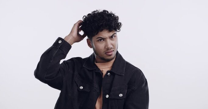 Confused, thinking or face of man scratching head in studio with question, brainstorming or choice on white background. Why, portrait or Indian guy model male with doubt, emoji or asking for solution