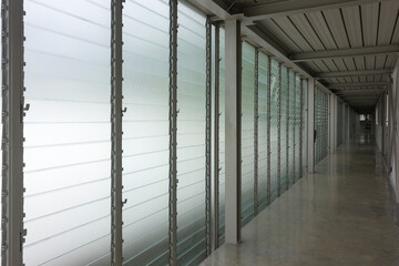 Modern hallway with glass louver windows wall