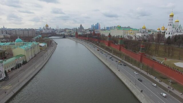 Kremlin quay with traffic and edifice of Christ Savior Cathedral