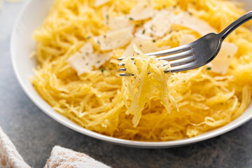 Spaghetti squash roasted and pulled apart served with olive oil and parmesan