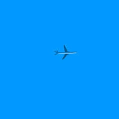 an airplane in the blue sky.