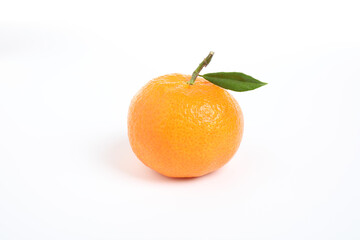 Fresh ripe tangerine with leaf isolated on white. Citrus fruit