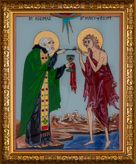 Icon painted on reverse glass in the naive orthodox style of Eastern Europe depicting Saint Mary of...