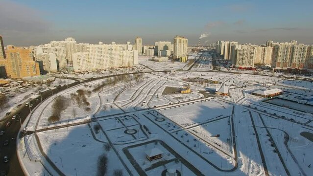 Roundabout with transport traffic near dwelling houses at winter 