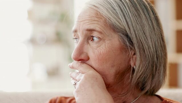 Anxiety, thinking and senior woman in a house with stress, fear or worry, Alzheimer or memory trauma. Depression, mental health or elderly female person with dementia, disaster or overthinking crisis