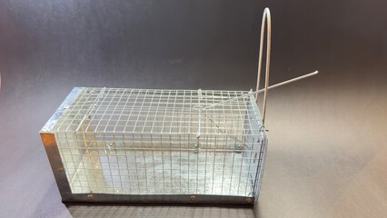 close-up of a non-lethal mousetrap. black background with copy space
