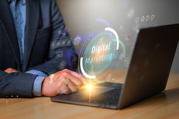 Digital marketing concept, businessman using laptop with Digital marketing on virtual screen...