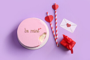 Bitten bento cake with gift box, straws and envelope on purple background. Valentine's Day celebration