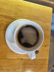 cup of coffee on wooden table