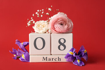 Cube calendar with date 8 MARCH and different beautiful flowers on red background. International...