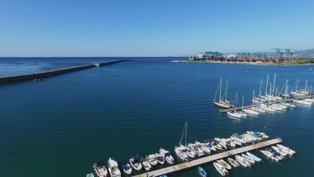 Boats on moorage at tourist landing marina Castelluccio 
