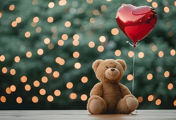 Fotobehang Teddy bear with a red heart shaped balloon on blurred background with golden lights. Cute bear toy holding heart. Valentine's day. Love and romantic concept © ratatosk