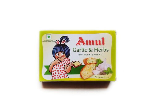 Guwahati, Assam, India - January 26, 2024 : Amul Garlic and Herbs Buttery Spread offers rich Garlic taste with Oregano herbs blended well in Classic Amul Butter gives it a unmatched taste and flavour.