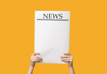 Woman with blank newspaper on yellow background - obrazy, fototapety, plakaty