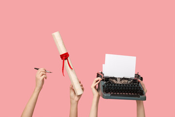 Women with vintage typewriter and diploma on pink background